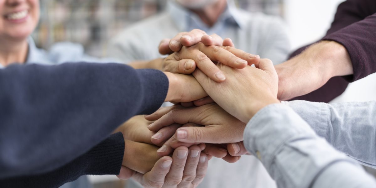 close-up-people-holding-hands-together (1)